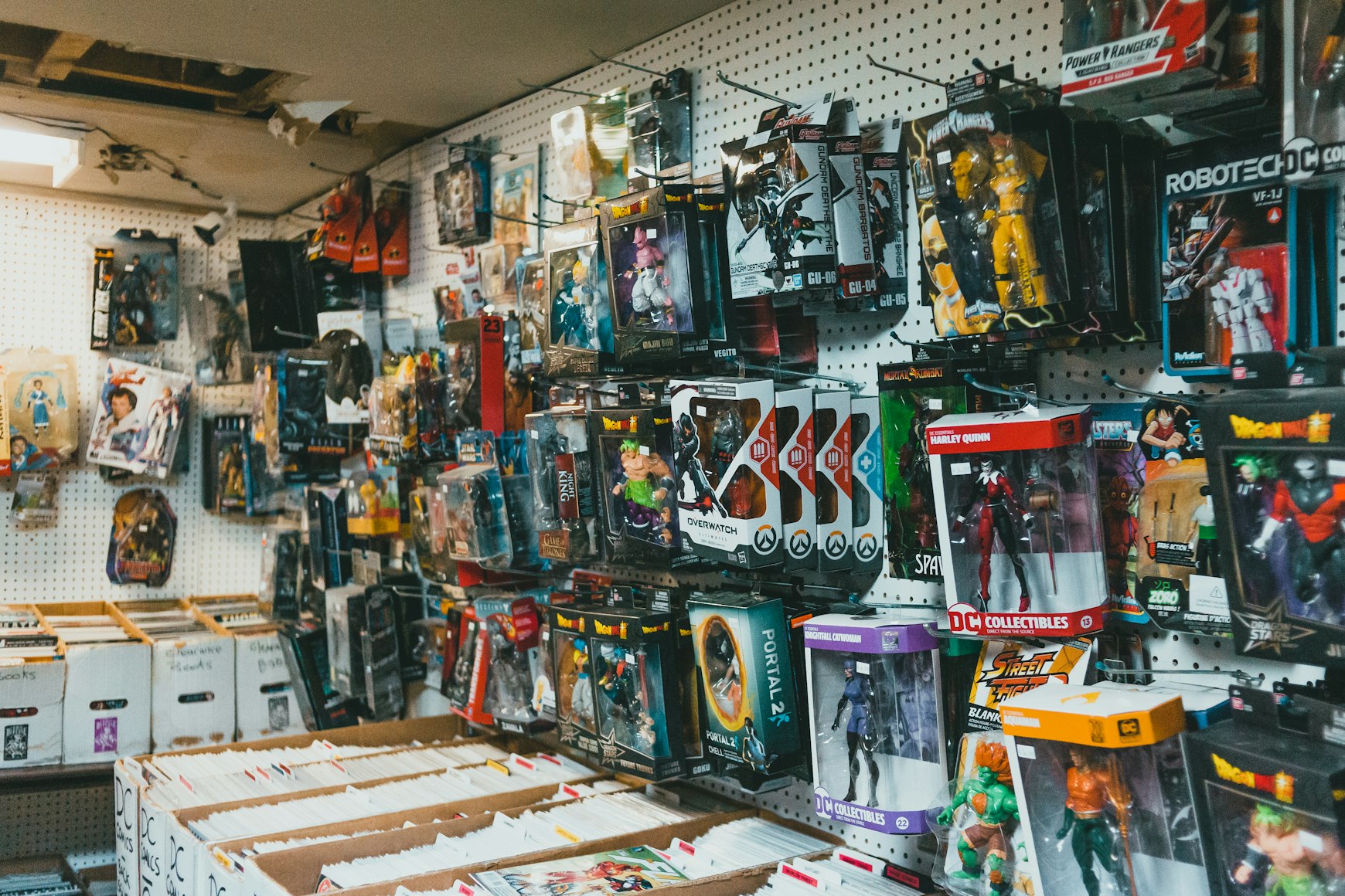A collector's shelf of trading cards and collectibles